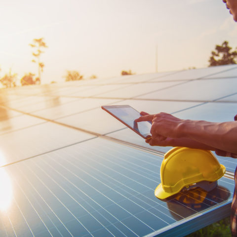 The engineer is checking the solar cell power system. - Image